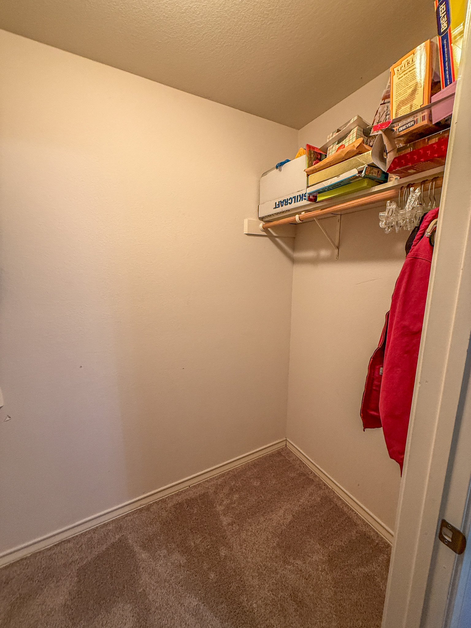 Undisclosed Address Georgetown, TX 78633 - Photo 27 of 37 a view of walk in closet with clothes and shoes