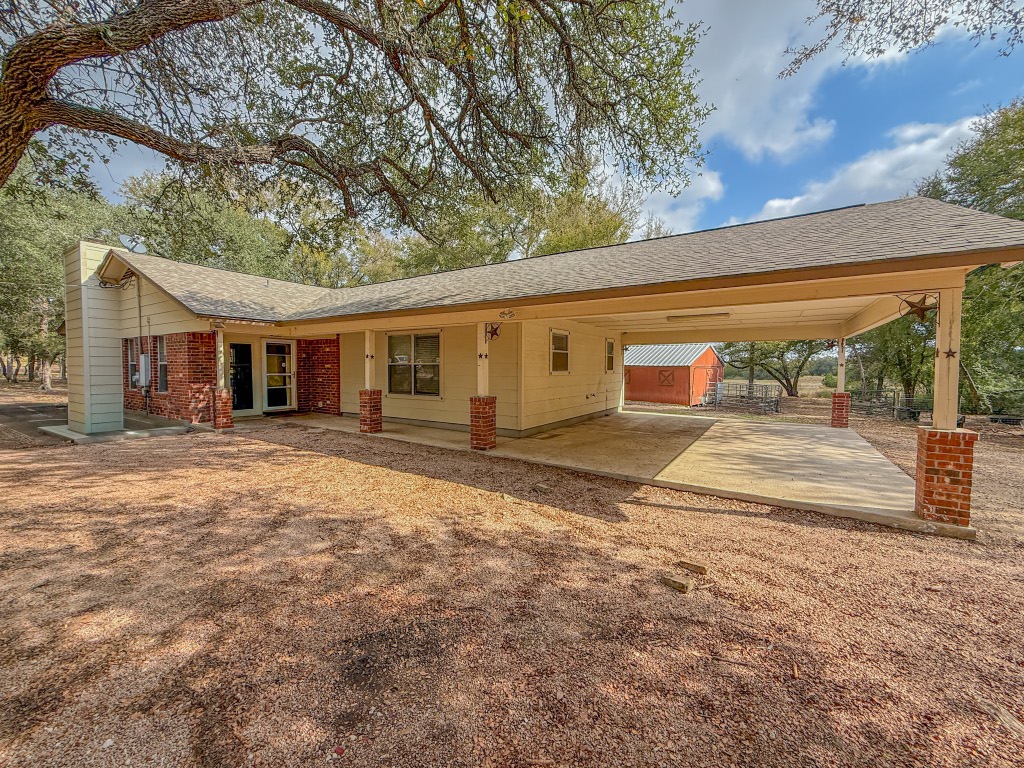 Undisclosed Address Georgetown, TX 78633 - Photo 8 of 37 View of front facade featuring an attached carport and a shingled roof