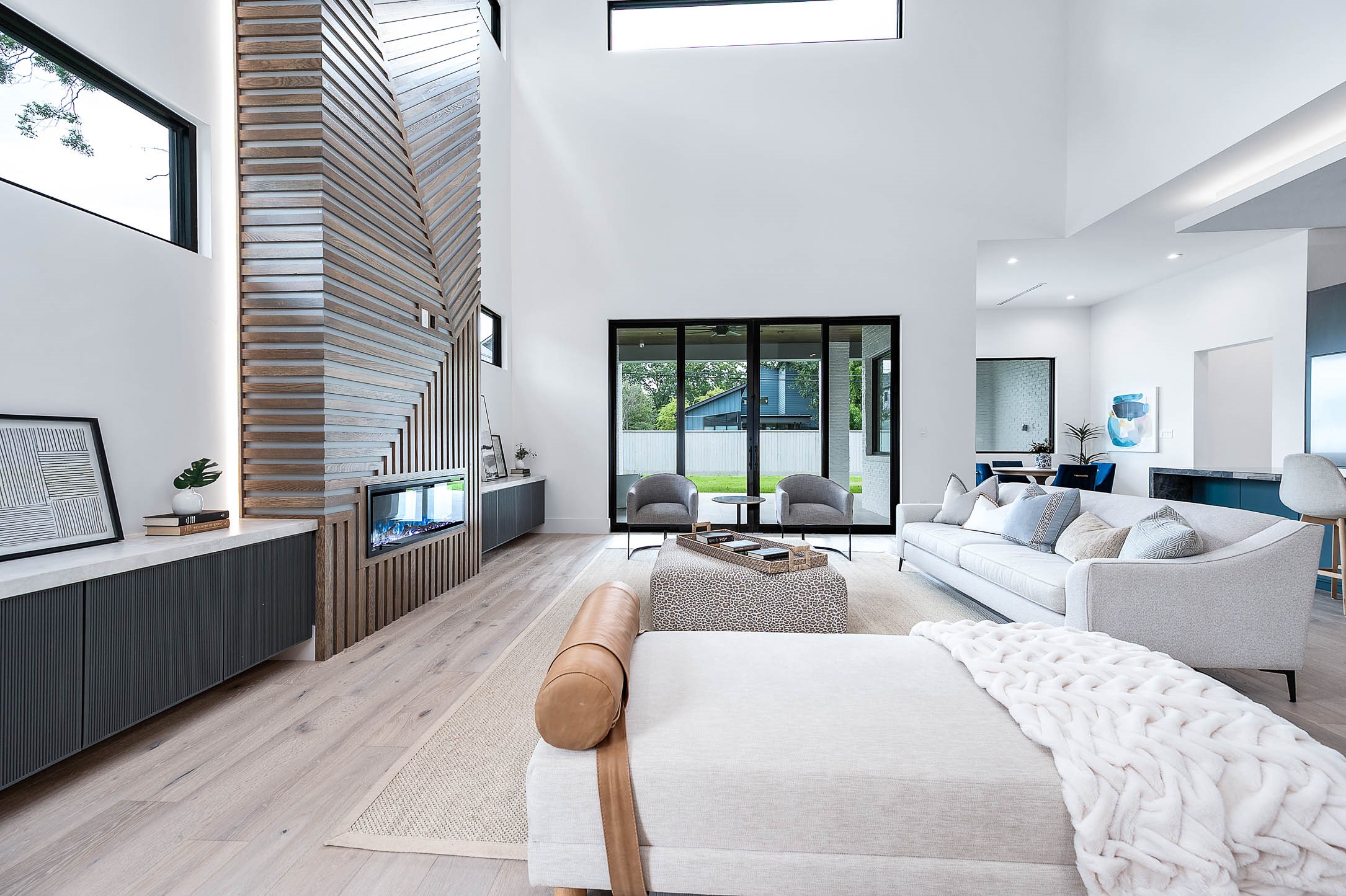 207 West 33rd Street Houston, TX 77018 - Photo 12 of 50 Living room with custom 12 foot glass sliding doors that seamlessly connect the indoor space to the backyard.