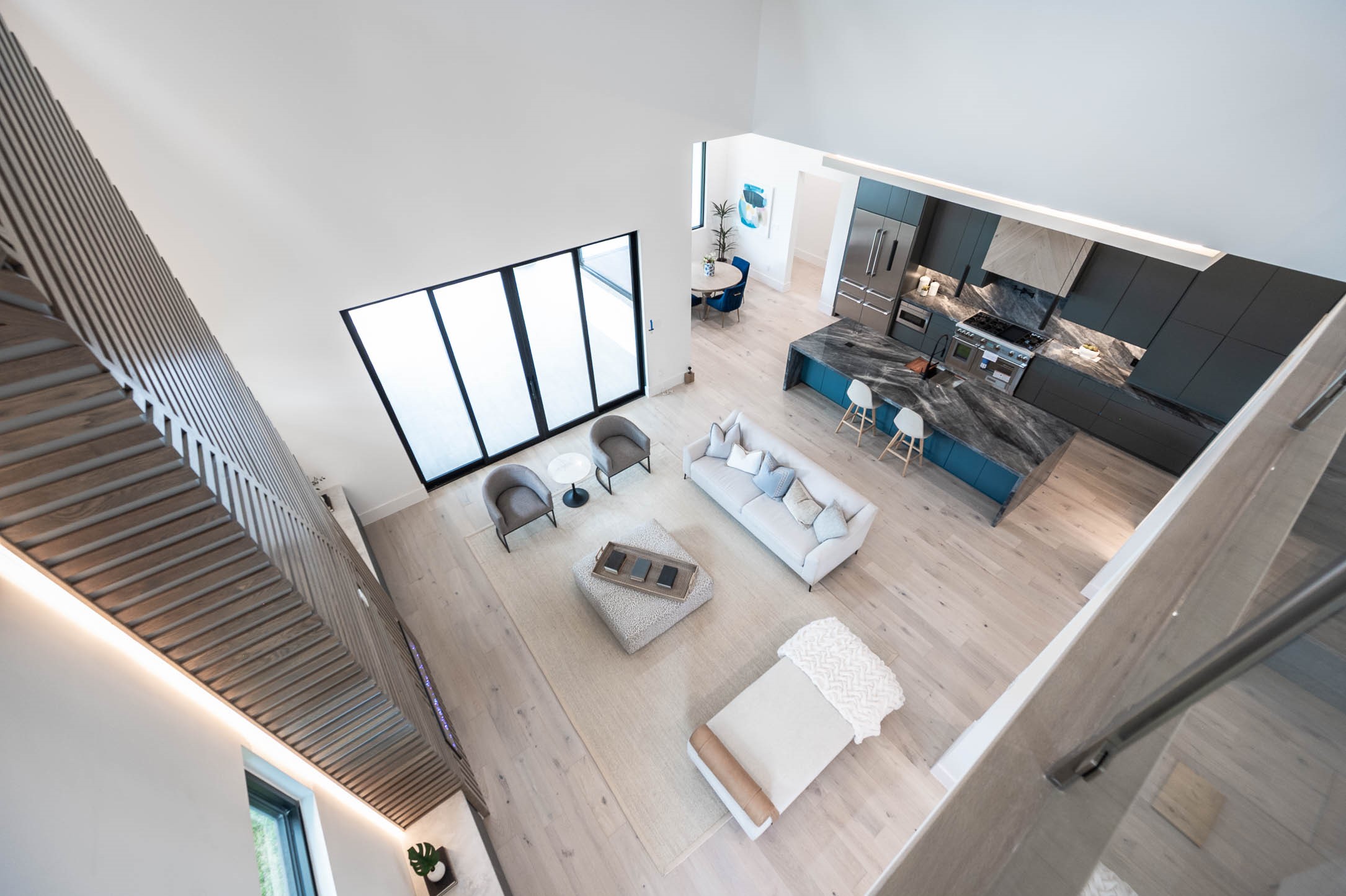 207 West 33rd Street Houston, TX 77018 - Photo 48 of 50 View overlooking the downstairs living area from the media room, showcasing an open and connected floor plan.