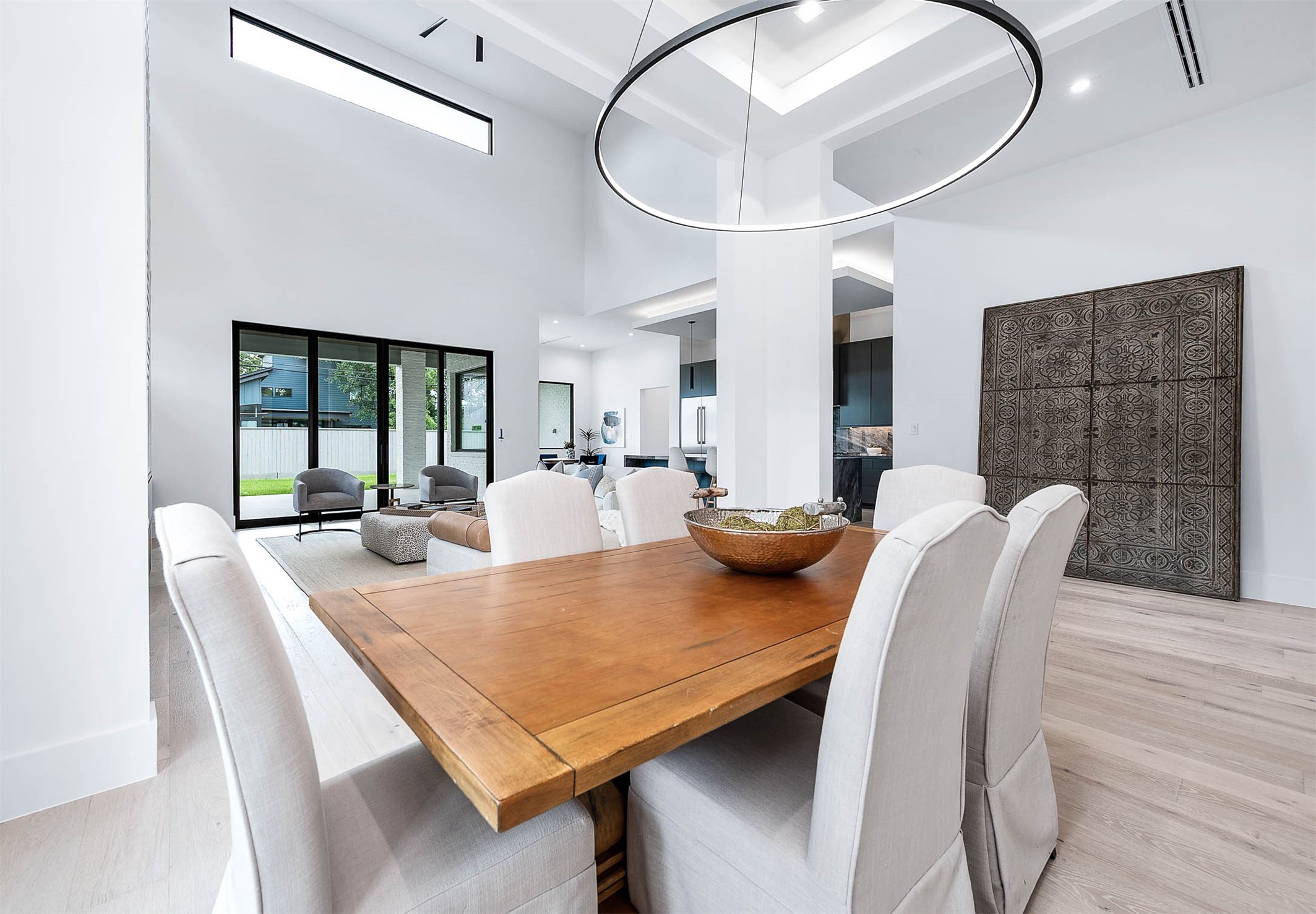 207 West 33rd Street Houston, TX 77018 - Photo 6 of 50 Dining room featuring an elegant recessed ceiling and a stylish chandelier with three adjustable color settings, creating the perfect ambiance for any occasion.