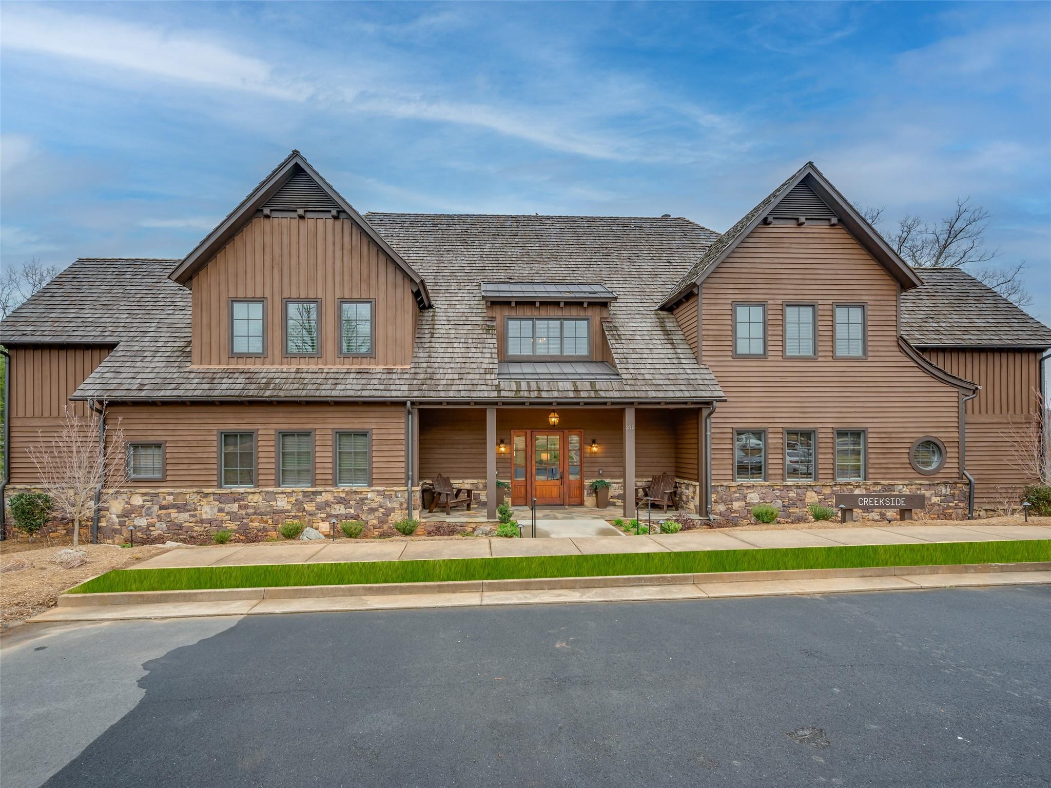 275 Clubhouse, Unit C301 Mill Spring, NC 28756 - Photo 1 of 41 a front view of house with yard and green space