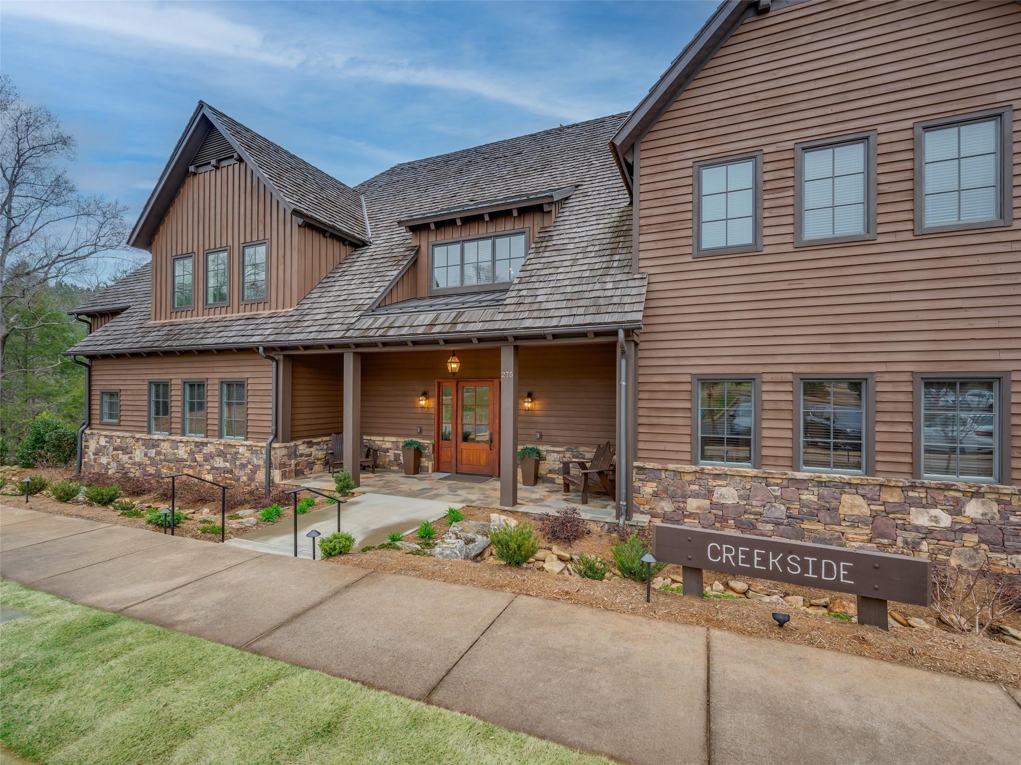 275 Clubhouse, Unit C301 Mill Spring, NC 28756 - Photo 2 of 41 a front view of a house with outdoor seating