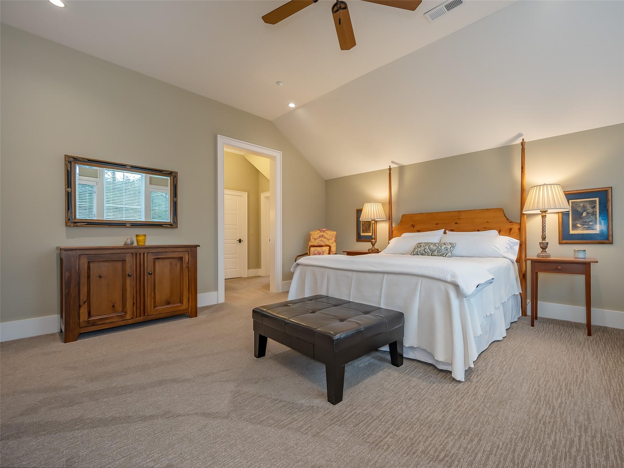 275 Clubhouse, Unit C301 Mill Spring, NC 28756 - Photo 23 of 41 a spacious bedroom with a bed a dresser and painting on the wall