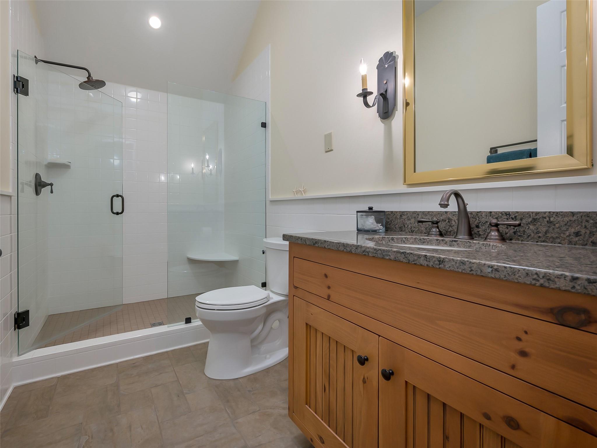 275 Clubhouse, Unit C301 Mill Spring, NC 28756 - Photo 28 of 41 a bathroom with a granite countertop sink toilet and shower