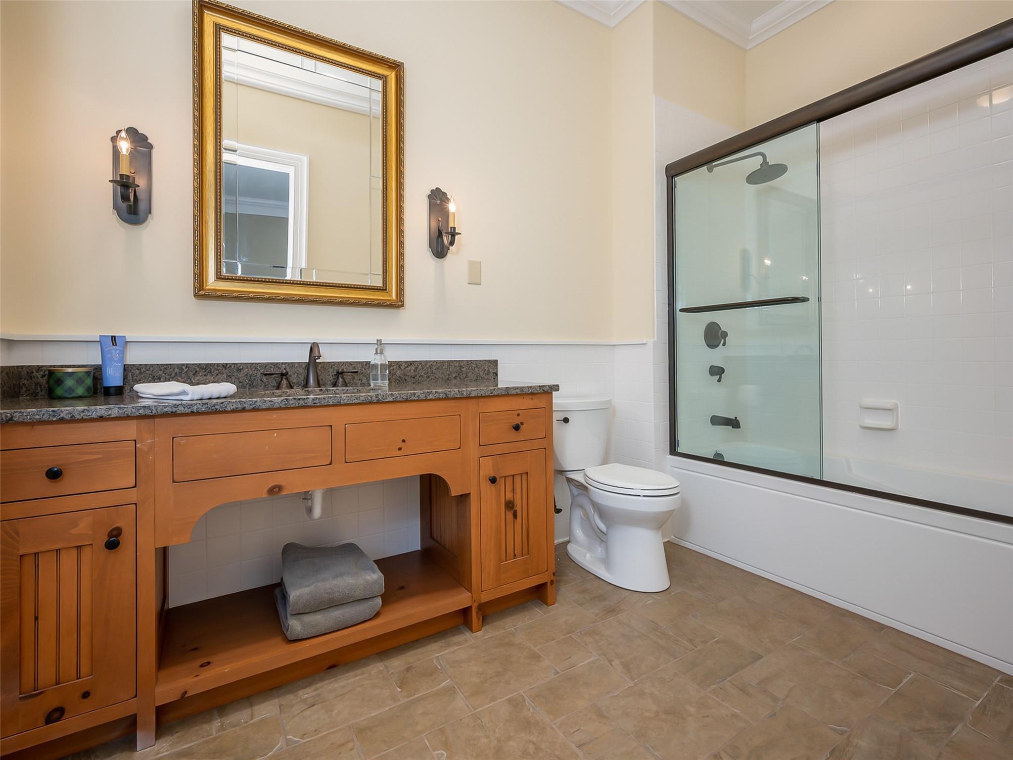 275 Clubhouse, Unit C301 Mill Spring, NC 28756 - Photo 31 of 41 a bathroom with a granite countertop toilet sink and mirror