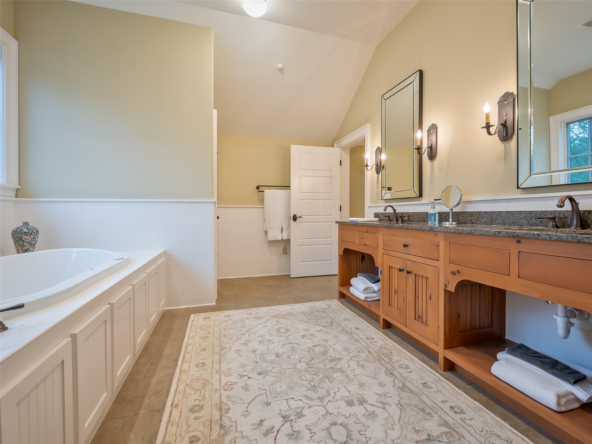 275 Clubhouse, Unit C301 Mill Spring, NC 28756 - Photo 33 of 41 a spacious bathroom with a sink double vanity and a mirror