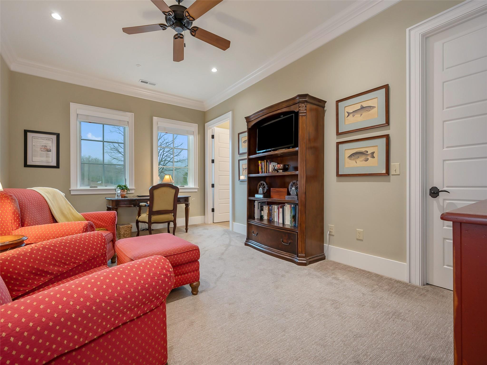 275 Clubhouse, Unit C301 Mill Spring, NC 28756 - Photo 34 of 41 a living room with furniture a ceiling fan and a window