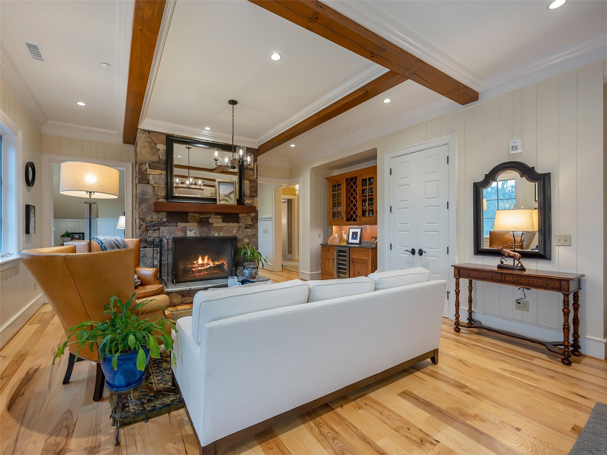 275 Clubhouse, Unit C301 Mill Spring, NC 28756 - Photo 9 of 41 a living room with furniture a fireplace and a potted plant