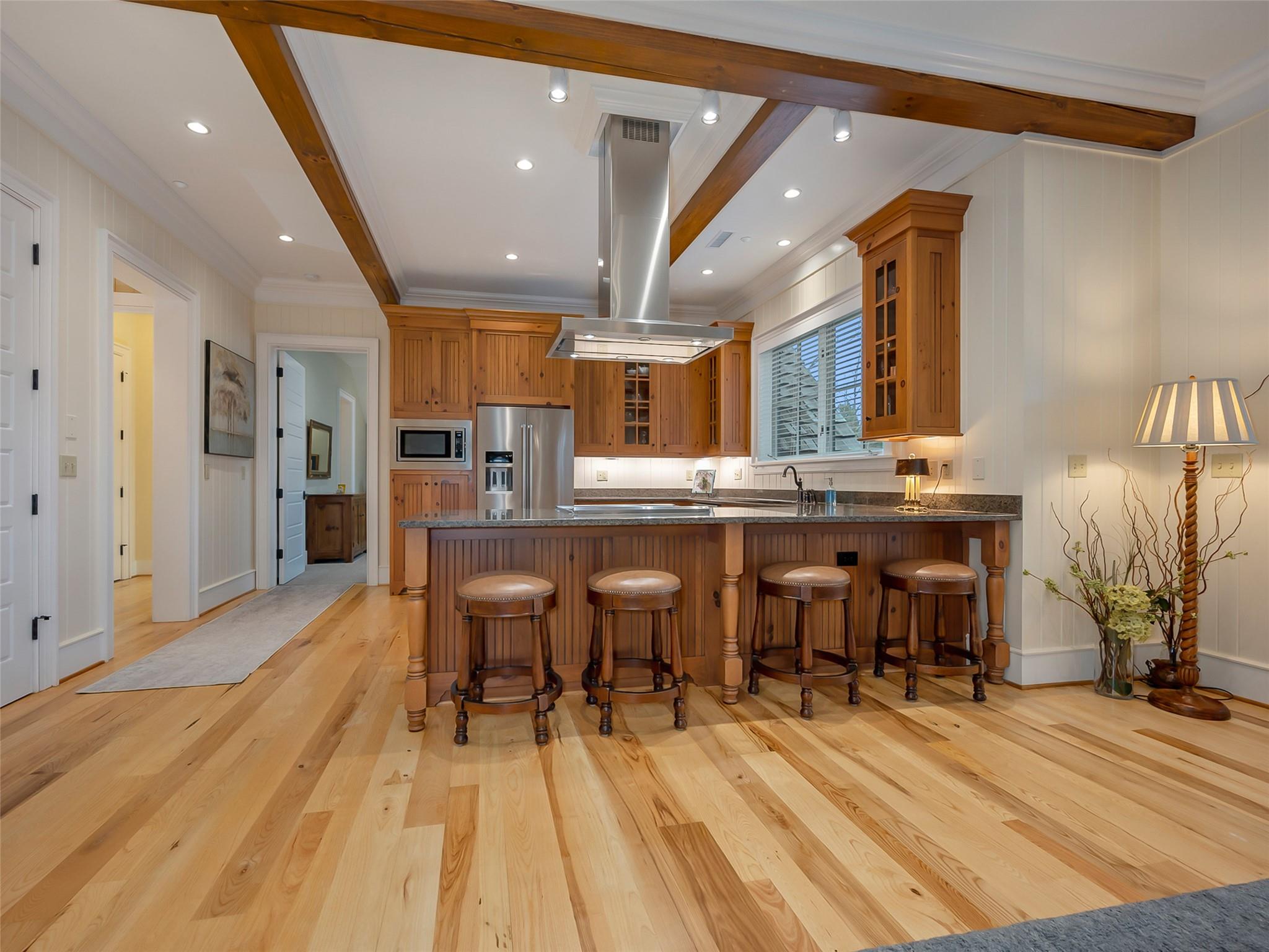 275 Clubhouse, Unit C301 Mill Spring, NC 28756 - Photo 10 of 41 a dining hall with stainless steel appliances kitchen island granite countertop a dining table chairs and granite counter tops
