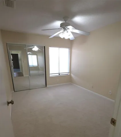 a view of empty room with windows