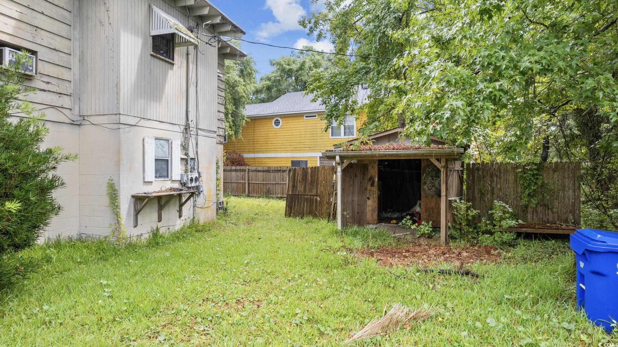 317 South Myrtle Drive Surfside Beach, SC 29575 - Photo 6 of 9 View of yard with a shed