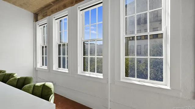 a view of a house with a window and wooden floor
