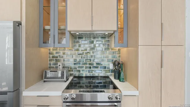 a bathroom with a stove and a shower