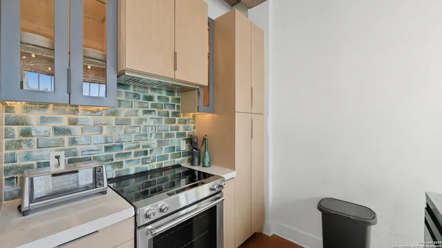 a kitchen with a stove and a microwave