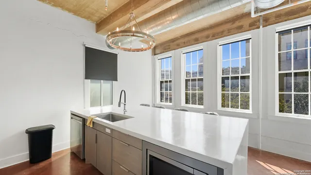 a view of a living room with furniture and a flat screen tv