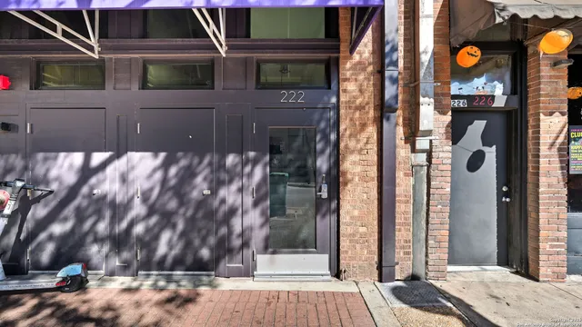 a view of a house with a street