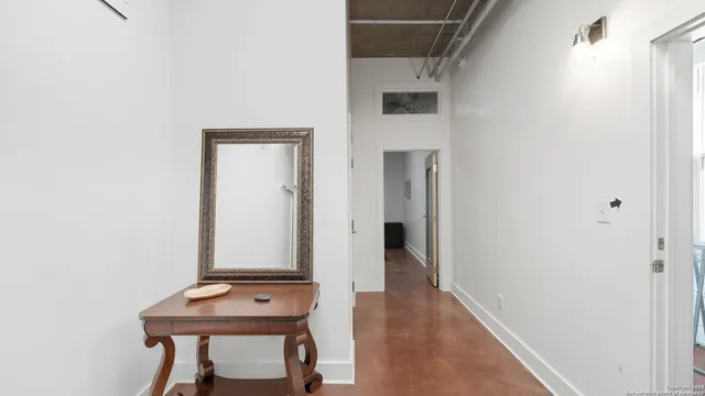 a room with table and mirror