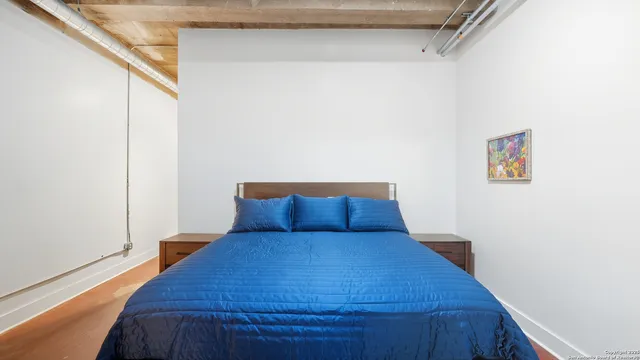 a bed sitting in a bedroom next to a small yard