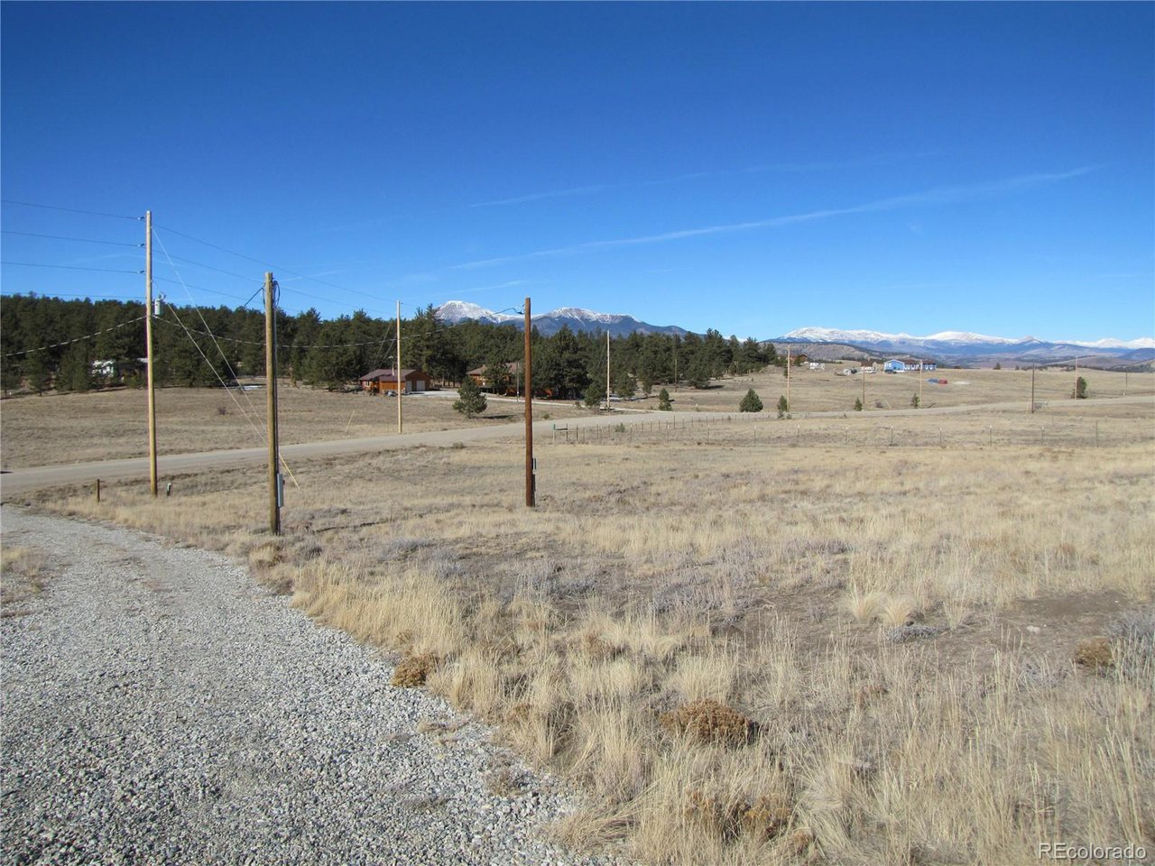 2626 Ranch Road Hartsel, CO 80449 - Photo 6 of 27 a view of a dry yard with wooden fence