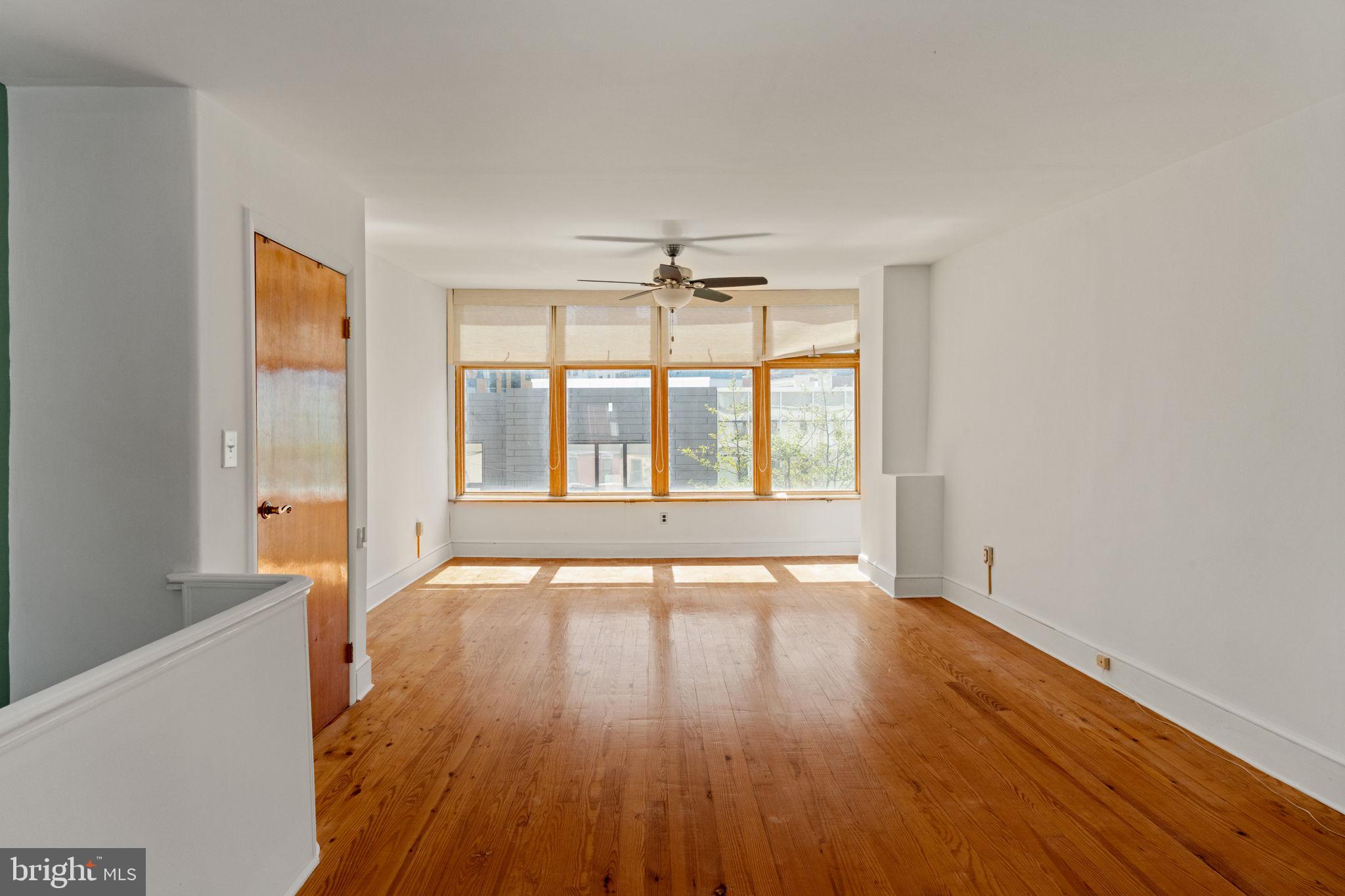 3633 Warren Street Philadelphia, PA 19104 - Photo 32 of 38 wooden floor in an empty room with a window