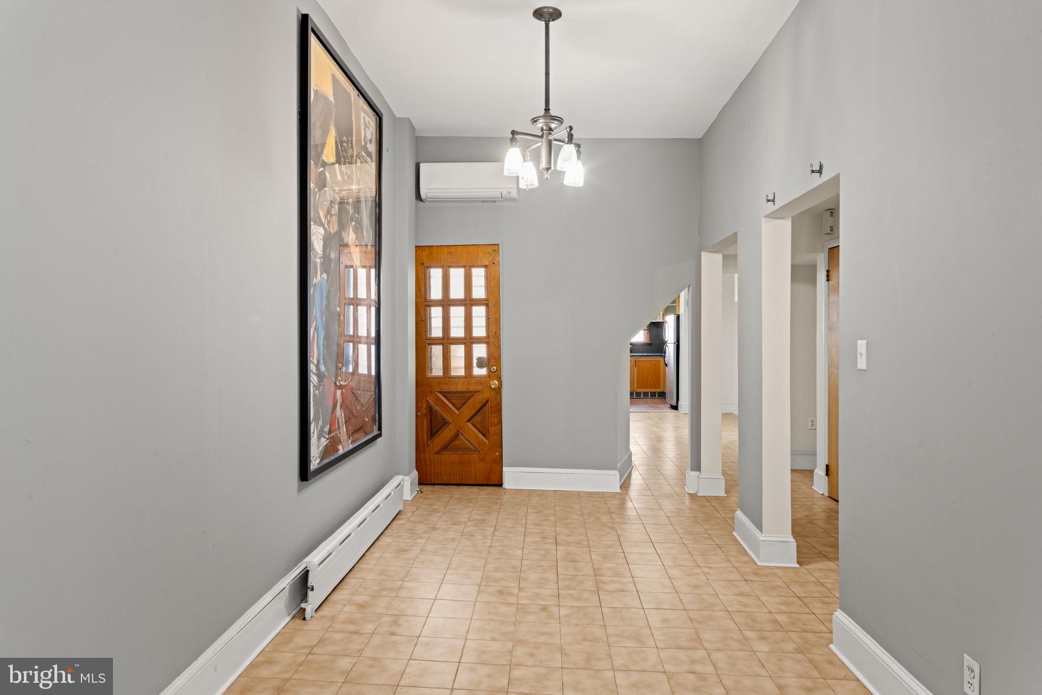 3633 Warren Street Philadelphia, PA 19104 - Photo 9 of 38 a view of a room with chandelier and windows