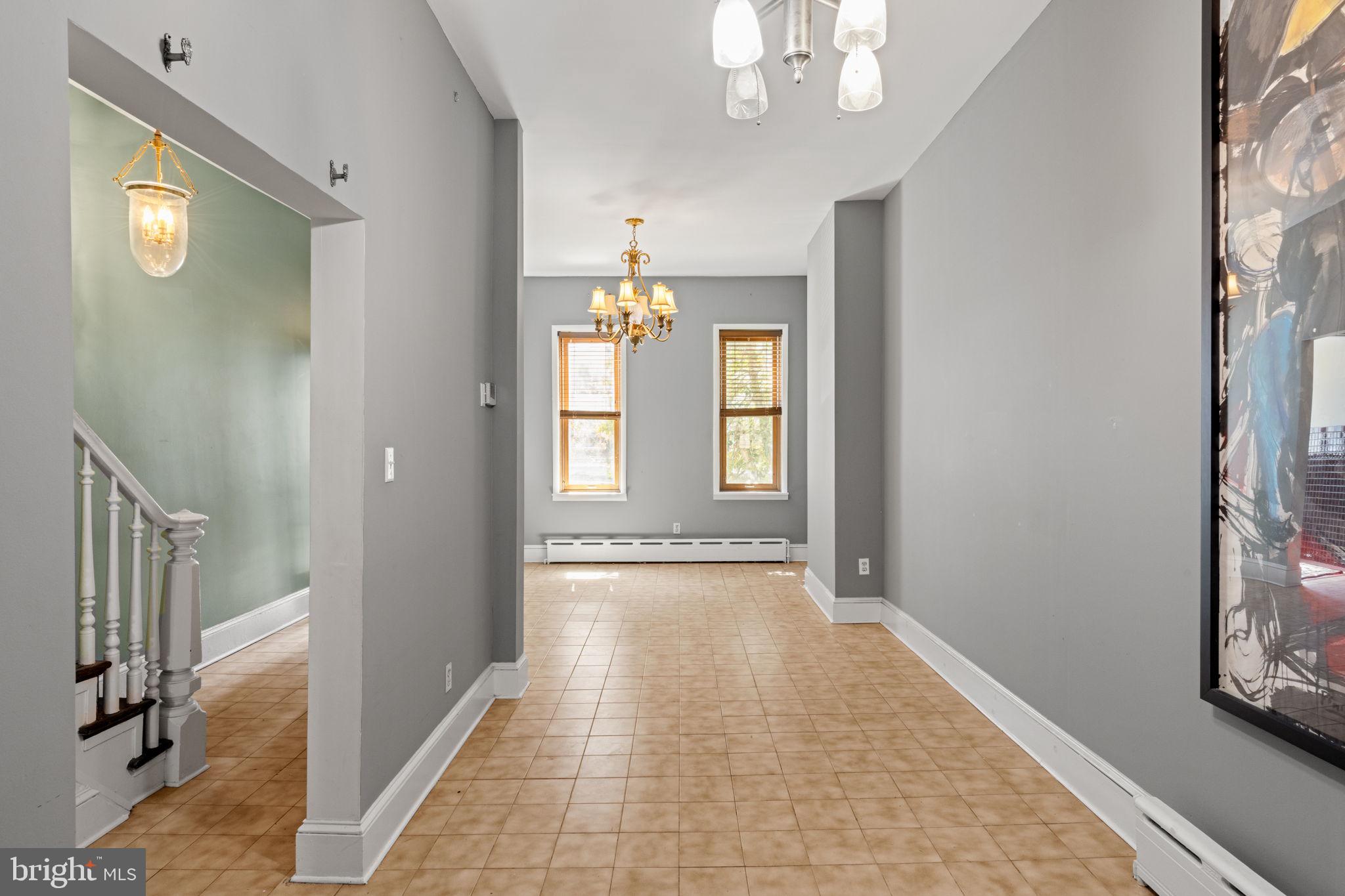 3633 Warren Street Philadelphia, PA 19104 - Photo 10 of 38 a view of a hallway with windows and chandelier