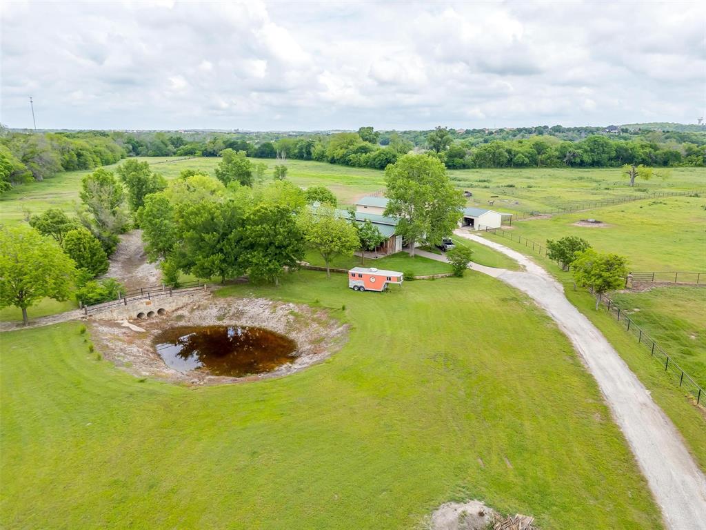 173 Trinity Bluffs Road Aledo, TX 76008 - Photo 2 of 40 a view of a lake with a yard