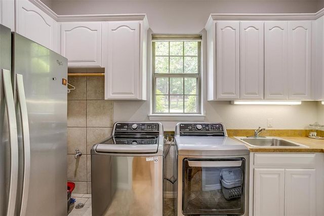a kitchen with a stove and a refrigerator