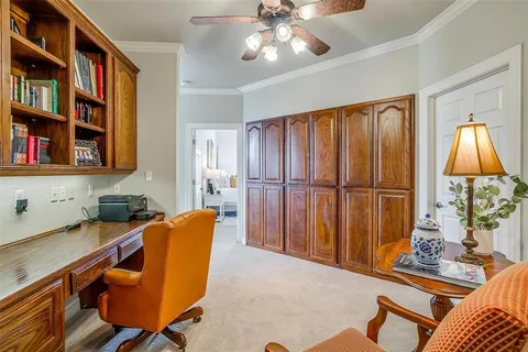 a blue room with furniture and a book shelf