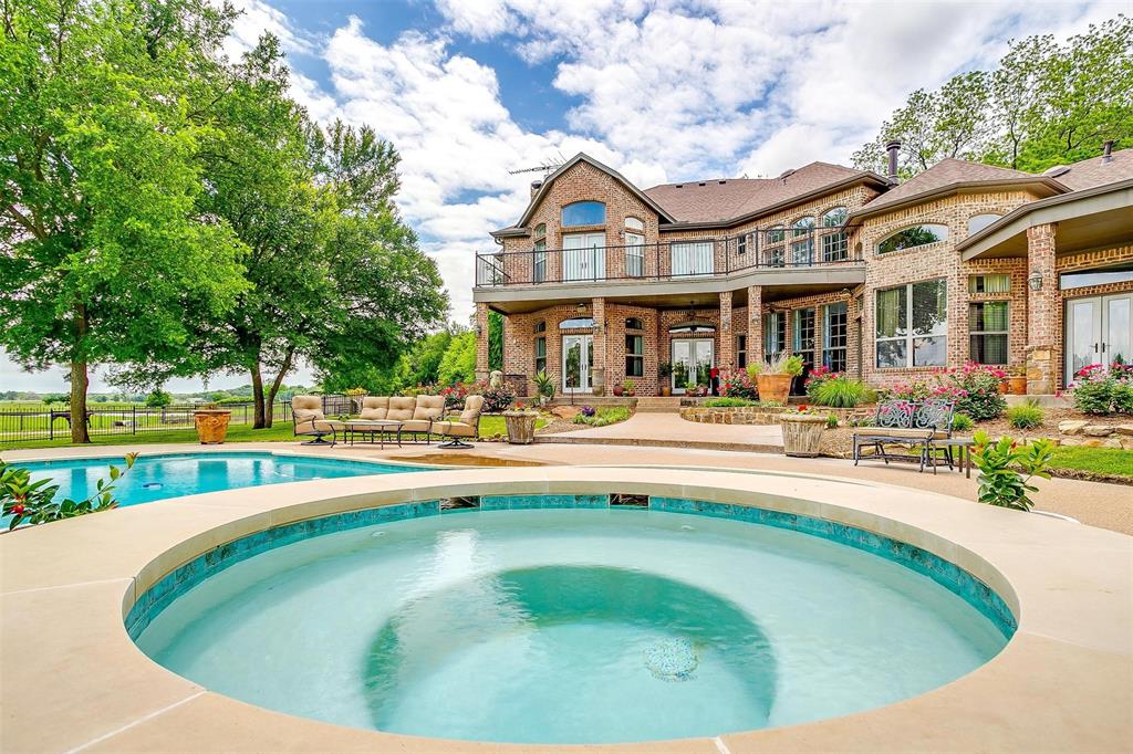 173 Trinity Bluffs Road Aledo, TX 76008 - Photo 40 of 40 a view of a swimming pool with outdoor seating and a big yard