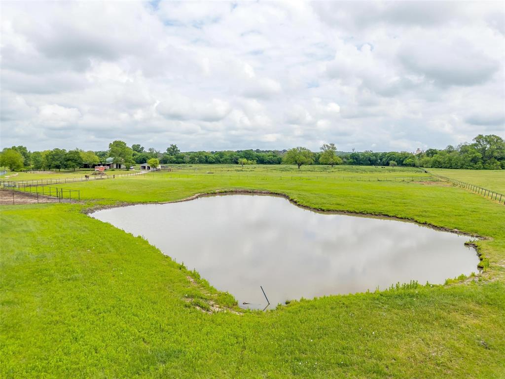 173 Trinity Bluffs Road Aledo, TX 76008 - Photo 6 of 40 a view of a lake with a big yard