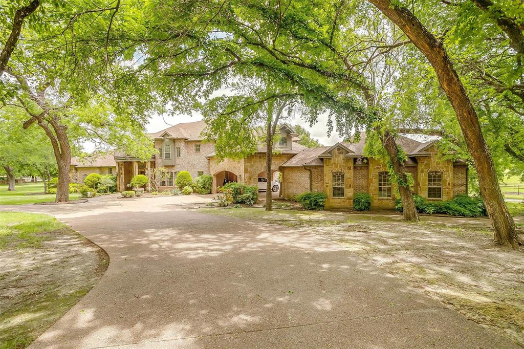 173 Trinity Bluffs Road Aledo, TX 76008 - Photo 9 of 40 a view of a large trees in front of a building