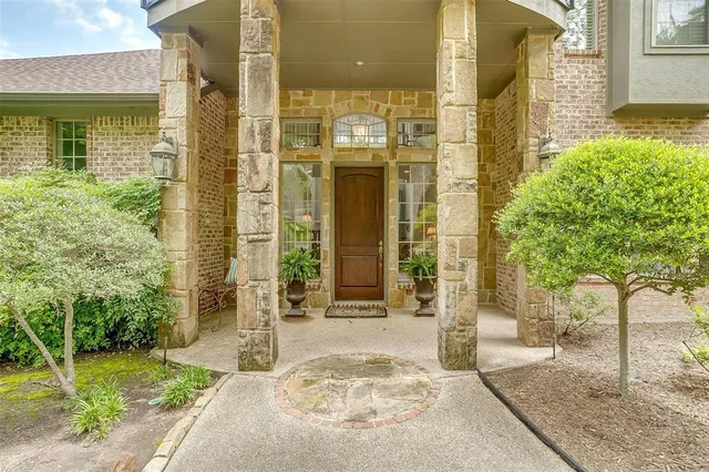 a view of a brick house with a large windows