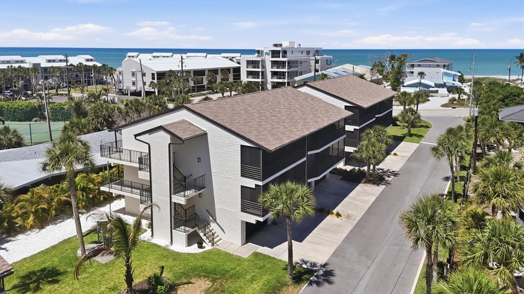 2729 North Beach Road, Unit 211 Englewood, FL 34223 - Photo 7 of 51 an aerial view of multiple house