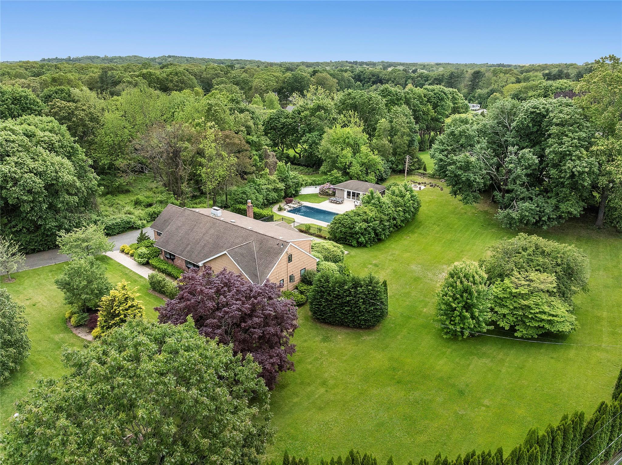 80 Woodlea Road Muttontown, NY 11791 - Photo 1 of 1 View of subject property with towering mature trees creating walls of natural privacy