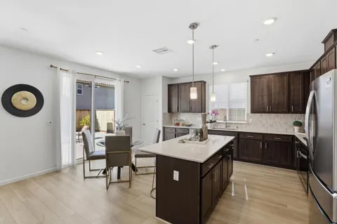 a kitchen that has a sink and a stove