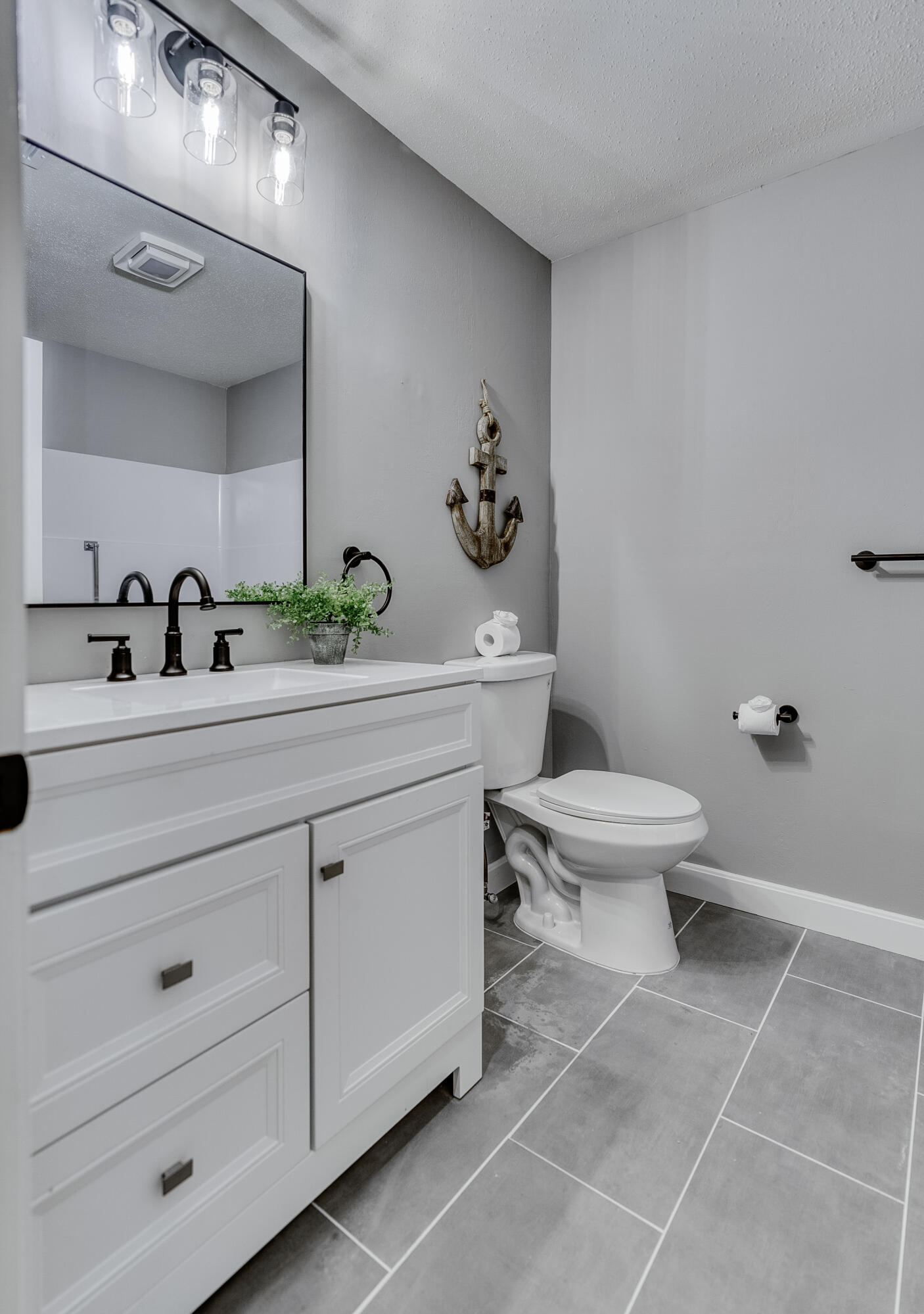 32 Sandy Reach Teaticket, MA 02536 - Photo 14 of 25 a bathroom with a sink a toilet and mirror