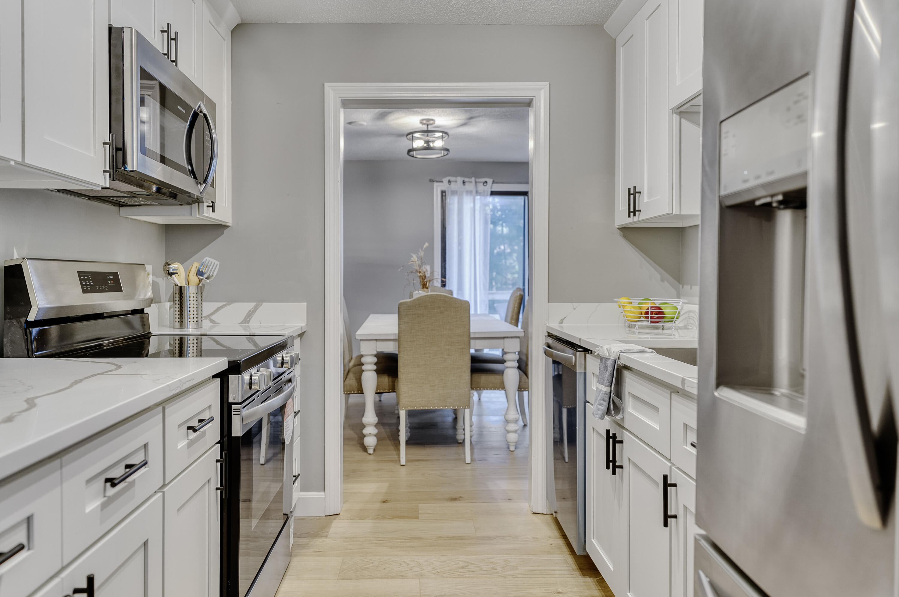 32 Sandy Reach Teaticket, MA 02536 - Photo 7 of 25 a kitchen with stainless steel appliances granite countertop a refrigerator and a stove