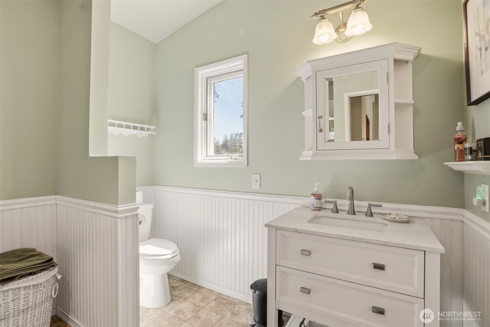 12119 South Spotted Road Cheney, WA 99004 - Photo 20 of 40 a bathroom with a toilet sink a mirror and vanity