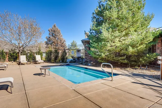 a view of backyard with deck and garden