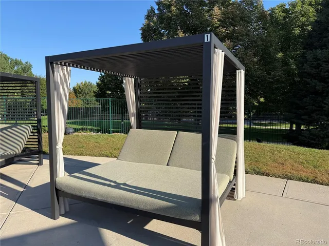 a view of a backyard with plants and a patio