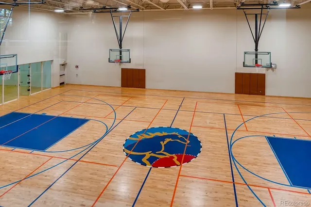 a bedroom with a bed and a view of a projector