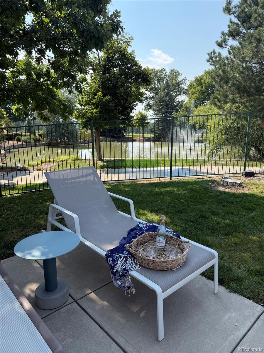 8578 Gold Peak Drive, Unit D Highlands Ranch, CO 80130 - Photo 40 of 50 a view of a backyard with sitting area and garden
