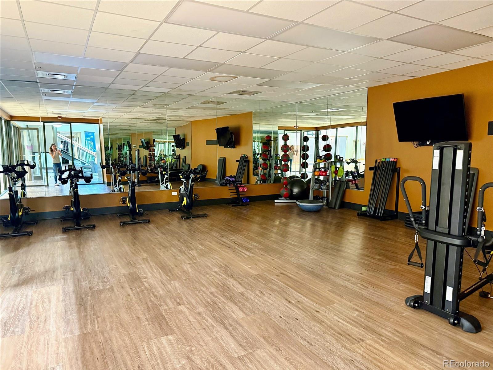 8578 Gold Peak Drive, Unit D Highlands Ranch, CO 80130 - Photo 45 of 50 a view of a room with gym equipment