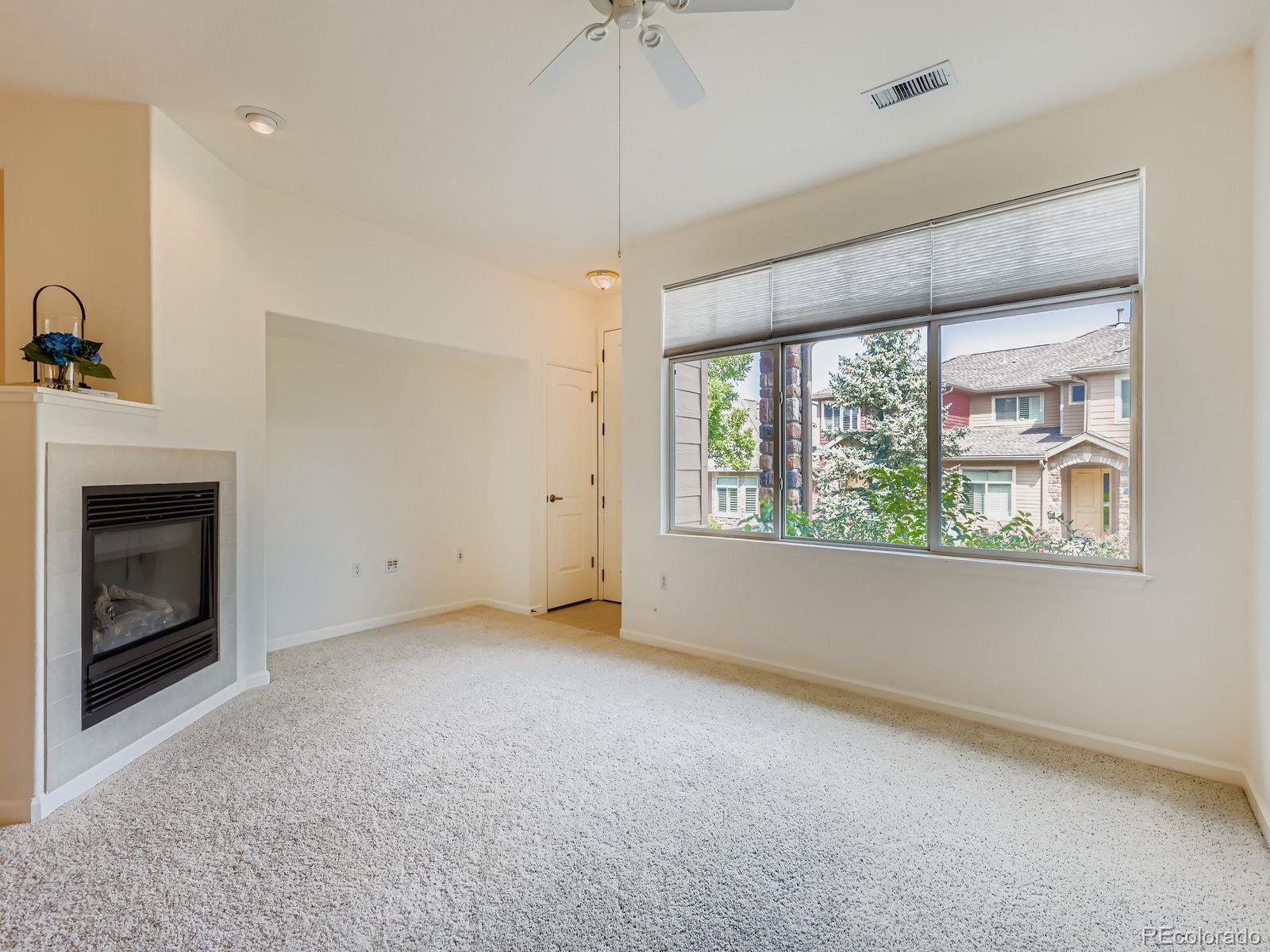 8578 Gold Peak Drive, Unit D Highlands Ranch, CO 80130 - Photo 7 of 50 a view of an empty room with a window