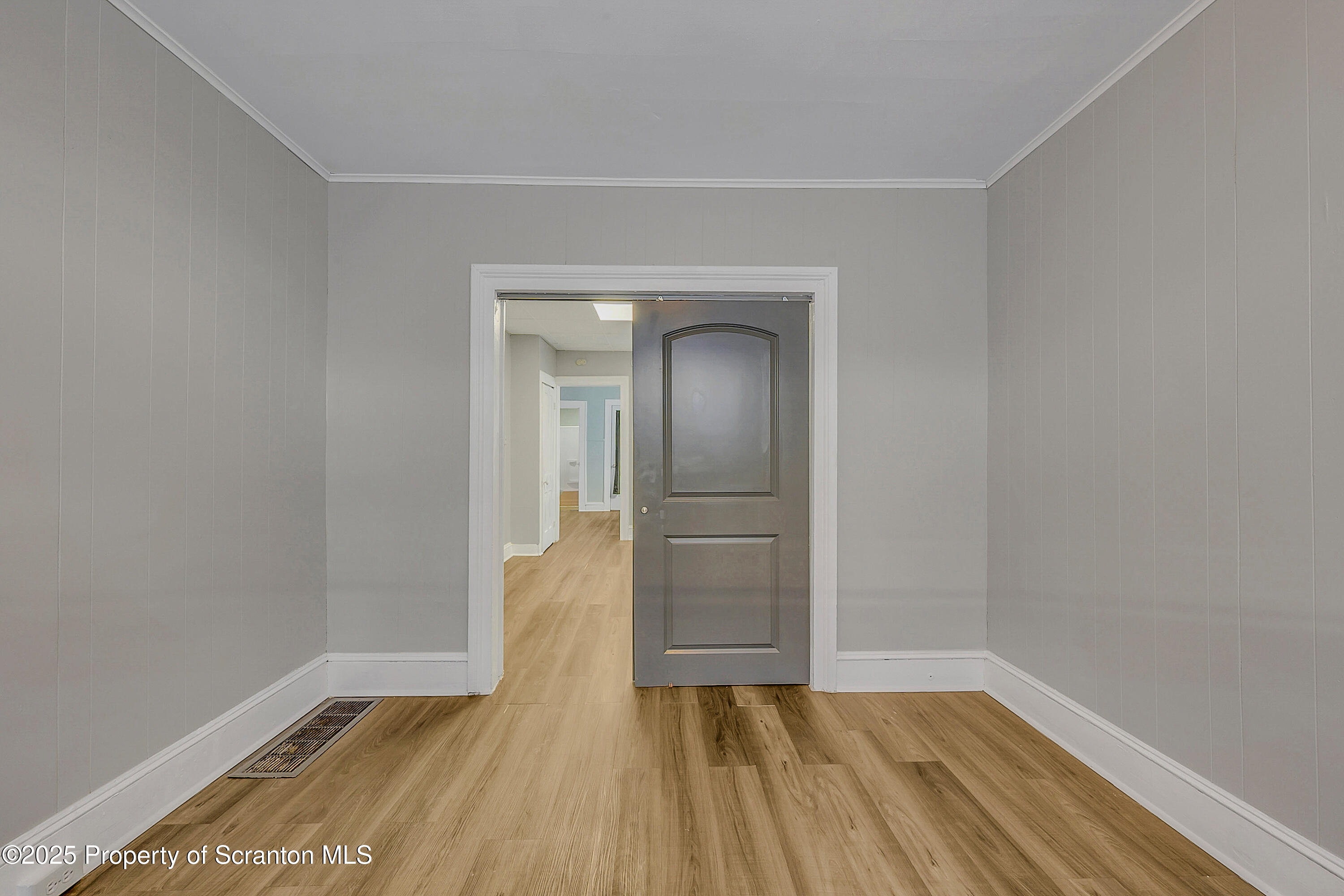 1007 Washburn Street, Unit 1 Scranton, PA 18504 - Photo 5 of 14 an empty room with wooden floor and closet