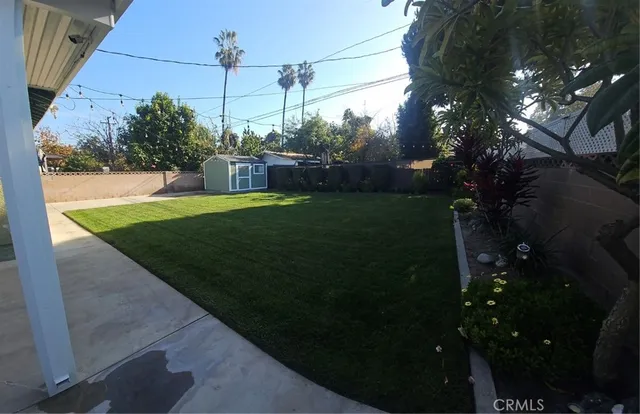 a view of a yard in front of a house