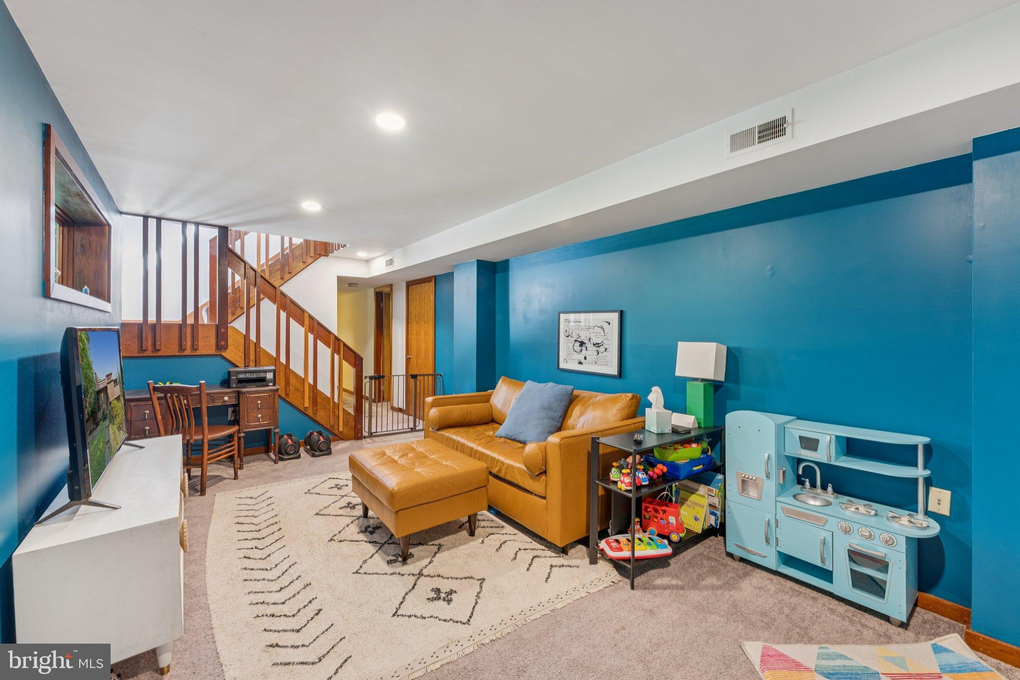 1684 Chain Bridge Road McLean, VA 22101 - Photo 16 of 23 a living room with furniture and stairs