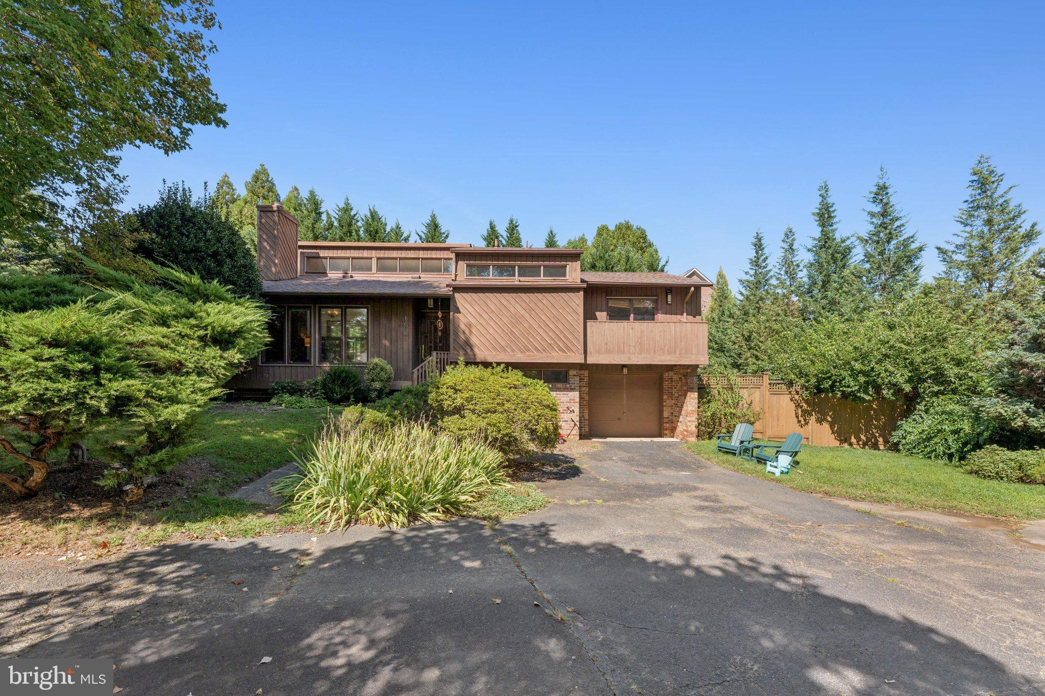 1684 Chain Bridge Road McLean, VA 22101 - Photo 21 of 23 front view of a house with a street